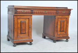 An early 20th century French walnut twin pedestal office desk. Each pedestal with locker doors