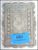 A Victorian silver hallmarked card case, by George Unite, Birmingham 1868, of shaped rectangular