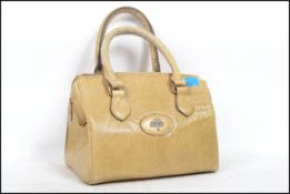 A Mulberry Made In England vintage ladies handbag of leather construction having a snakeskin