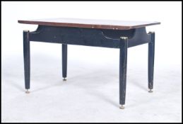 A G-plan Librenza pattern coffee table having a teak top and ebonized legs. Measures 44cms x 74cms x