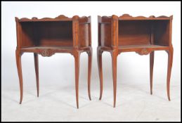 A pair of 19th century walnut and oak French gallery topped bedsides raised on shaped tapering