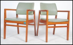 A superb pair pf 1970's Retro Danish inspired teak and black vinyl upholstered War Department -