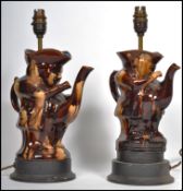 A near pair of table lamps, converted from 19th century teapots in the form of Toby Jugs raised on