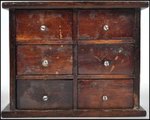 A vintage early 20th century apprentice piece chest of drawers of simple form having six draws