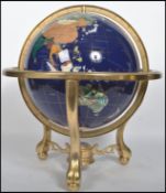 A large 20th century spherical globe having Lapis Lazuli inlay and inset semi precious stone