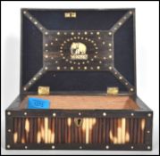A 19th century porcupine quill worked  ebony and bone inlaid box with brass armorial escutcheon to
