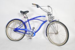A vintage 20th century fixed speed two tone blue and white beach cruiser bike / bicycle by Dyno