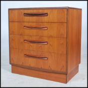 A 1970's G-Plan teak wood Kelso Pattern chest of drawers being raised on an inset plinth with