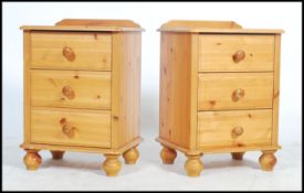 A pair of pine bedsides having three drawers raised on turned legs with gallery back topped.