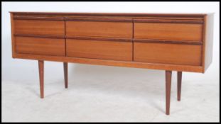 A 1960's teak six drawer sideboard having lipped p