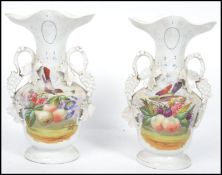 A pair of 20th century continental vases having a white ground decorated with birds and flowers, the