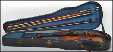 A 20th century Sebastian Klotz violin complete in the case together with 3 violin bows ( see
