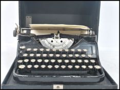 An early 20th century American made cased reporters typewriter by Underwood, glass keys, Underwood