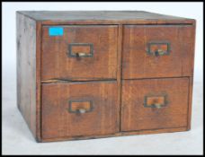 A 1930's oak Industrial  Edwardian four drawer ofice card index case filing cabinet. Measures