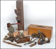 A collection of vintage 20th century woodworking tools to include planes etc together with four
