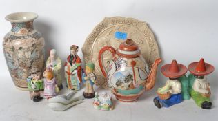 A collection of early 20th century and other Oriental Japanese ceramics to include figures, book