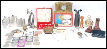 A good mixed lot to include three vintage 20th century hip flasks two of traditional form one of