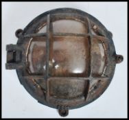 A good fish mid century Industrial cage light of circular form believed to have been taken from