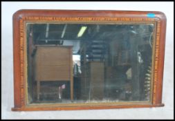 A Victorian mahogany tunbridge inlaid overmantel mirror having central mirror glass with inlaid