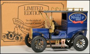 A vintage 20th century tin plate 1/13 scale car in the style of George Carette with decals for