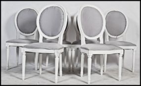A set of six 20th century Louis style balloon back dining chairs with serpentine fronts raised on
