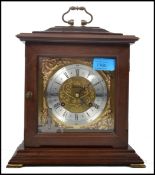 A vintage 20th century Metamec wooden cased mantle clock having a gilt back plate and spandrels,