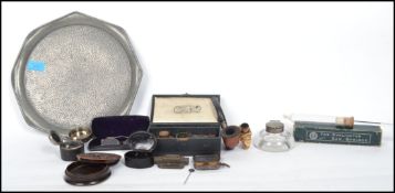 A collection of vintage curios dating back to the 19th century to include travelling ink wells,