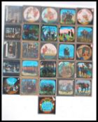 A collection of vintage 20th century glass plate slides to include many Punch and Judy, Napoleonic