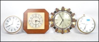 A collection of vintage 20th century retro clocks to include a Metamec Aztec clock, Motif, and two