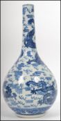A 19th century Kang-xi blue and white vase being decorated with 5 claw dragons with fireballs and
