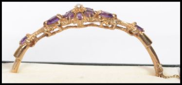 A stunning 20th century ladies 9ct gold, amethyst and seed pearl ladies 9ct gold bracelet.