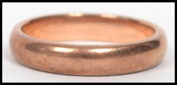 A 9ct gold band ring of usual simple form, bearing makers marks for X K, weighing xxg and