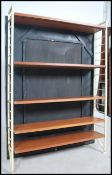 A vintage mid 20th century Ladderax modular shelving system unit fitted with a series of shelves.
