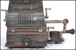 A vintage 20th century pressed metal industrial German Brunviga Nova 13Z portable adding machine