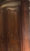 A stunning 19th century very large French oak  Armoire wardrobe having a dome top moulded cornice