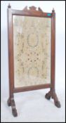 A 19th century Regency large fire / discretion screen. The solid oak frame on splayed legs having an