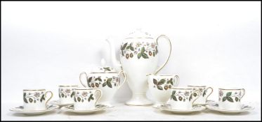A vintage 20th century Wedgwood ceramic coffee service decorated in the Strawberry Hill pattern