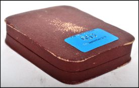 An unusual gilt silvered religious icon plaque being stamped to the rear and of armorial form.