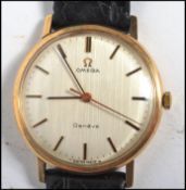 A vintage Omega Geneve Swiss made wristwatch having baton numerals Omega crown winder and
