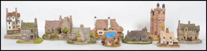 A collection of approximately twenty collectable Lilliput Cottages of varying designs all with