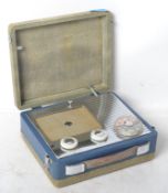 A vintage 20th century Pye radio having a hinged two tone case with handle atop.