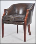 A good Georgian style leather desk chair upholstered in a brown leather with ribbed edges having
