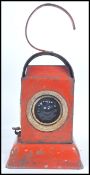 A Vintage Road mid century lamp by Kenyon's in Red colourway having an unusual stepped plinth