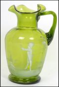 A 19th century Mary Gregory green glass ewer jug with white enamel overlay of girl amongst trees