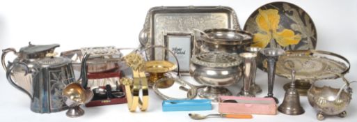 A large collection of silver plated ware to include solifleur vases, berry dishes, trays, teapots,