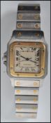 A 20th century mid sized Cartier wristwatch having a gold adorned face ( tested ) and set to a