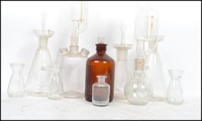 A good collection of vintage 20th century pharmaceutical glass to include 2 unusual pyrex flasks
