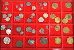 A collection of vintage antique coins and tokens to include Roman, English, Polish, Dutch, Papal