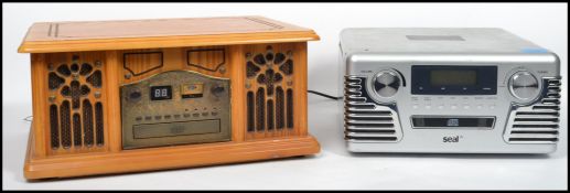 A modern antique style hi-fi in wooden case with radio, record player etc together with a