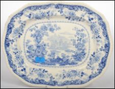 A large Victorian blue and white meat platter having classical scene to the centre being marked to